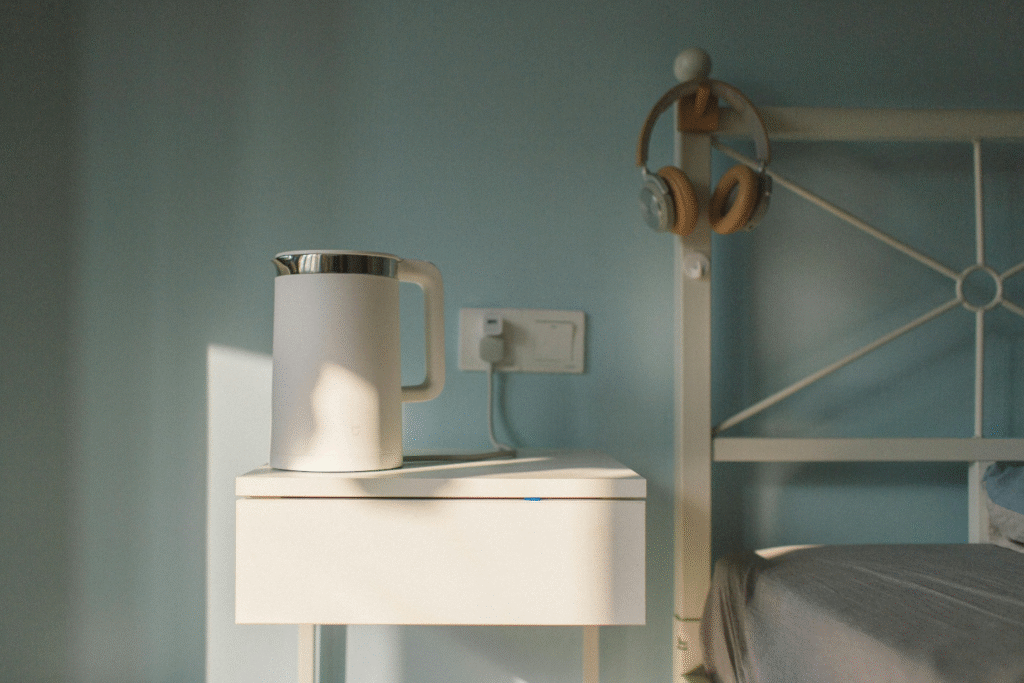 An electric kettle plugged into a dedicated socket