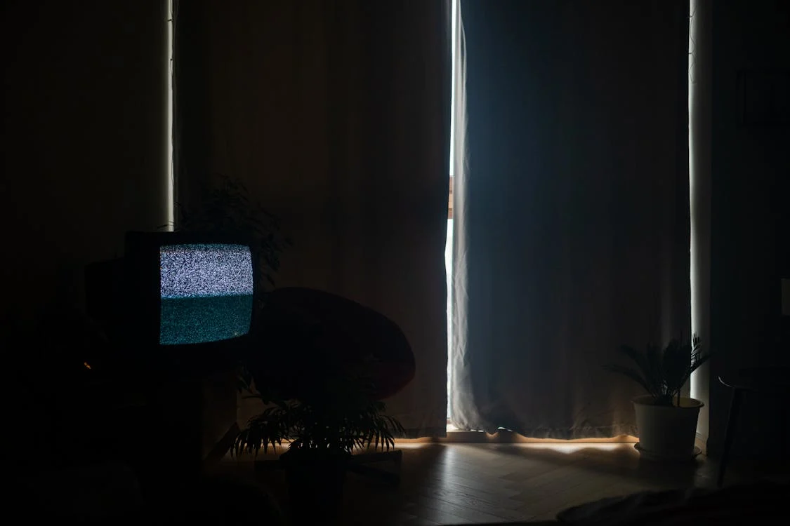 A dark living room with no electricity during a blackout